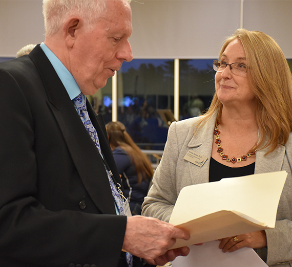 Students holding sign that reads "unity in humanity"